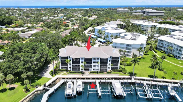 a couple of potted plants sitting in front of a building