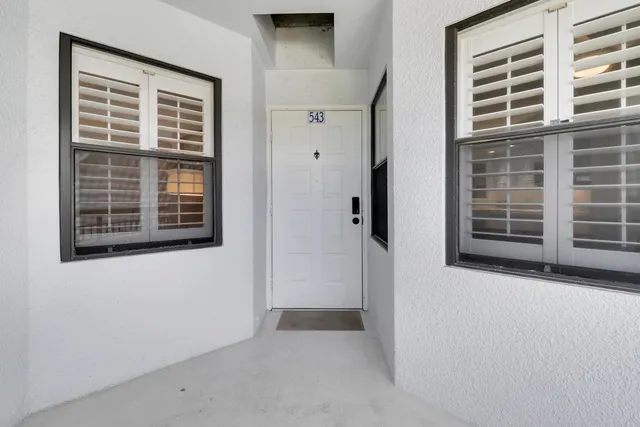 a view of a chairs and table in the terrace