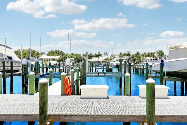 an aerial view of a house with a yard pool basket ball court and outdoor view