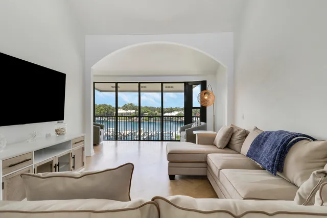 a living room with furniture and a large window with outer view
