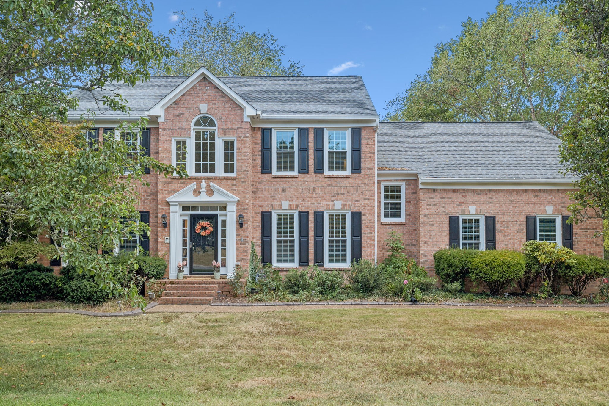 333 Springhouse Circle Franklin, TN 37067 - Photo 1 of 67 a front view of a house with a yard and trees