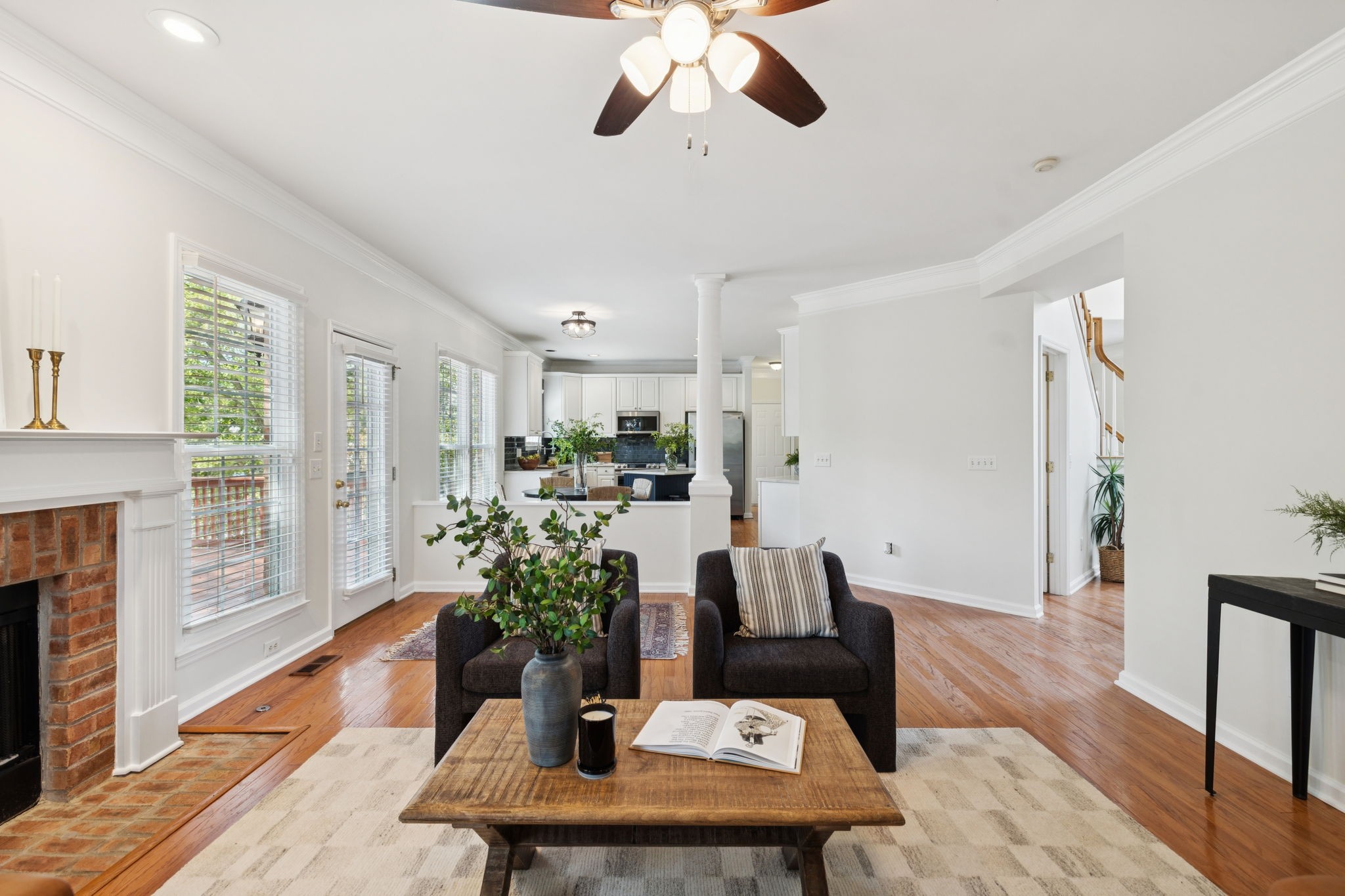 333 Springhouse Circle Franklin, TN 37067 - Photo 17 of 67 a living room with furniture potted plant and a fireplace