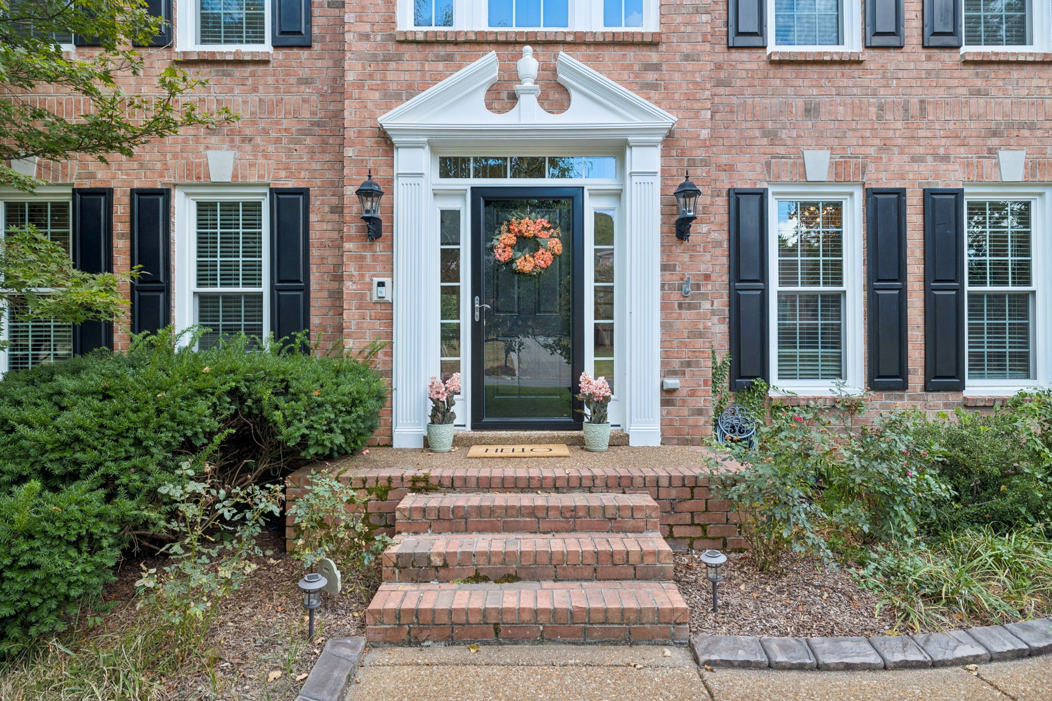 333 Springhouse Circle Franklin, TN 37067 - Photo 2 of 67 a front view of a house with a garden