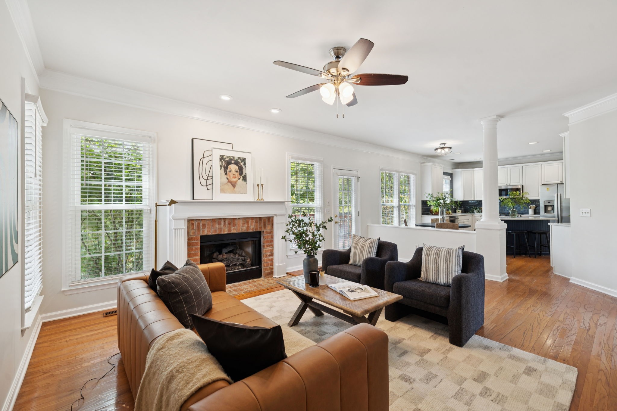 333 Springhouse Circle Franklin, TN 37067 - Photo 22 of 67 a living room with furniture and a fireplace