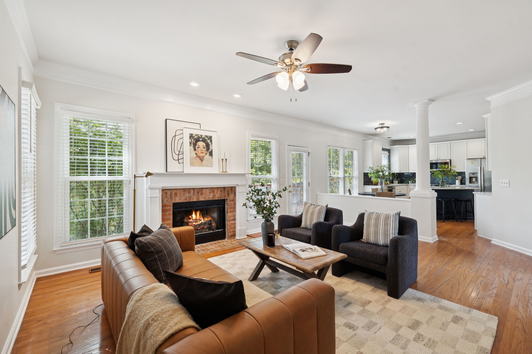 333 Springhouse Circle Franklin, TN 37067 - Photo 23 of 67 a living room with furniture and a fireplace