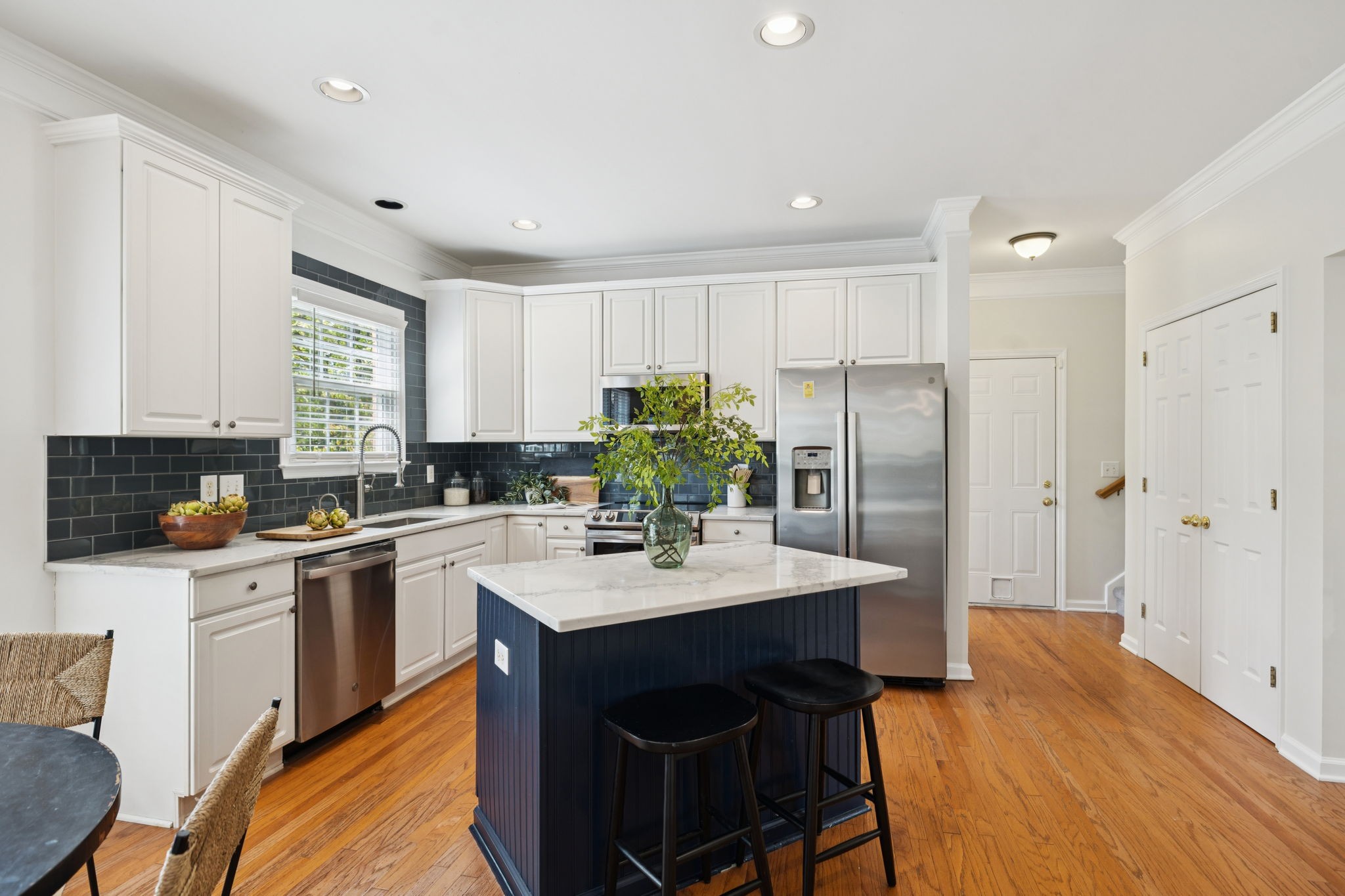 333 Springhouse Circle Franklin, TN 37067 - Photo 24 of 67 a kitchen with a sink stove and refrigerator
