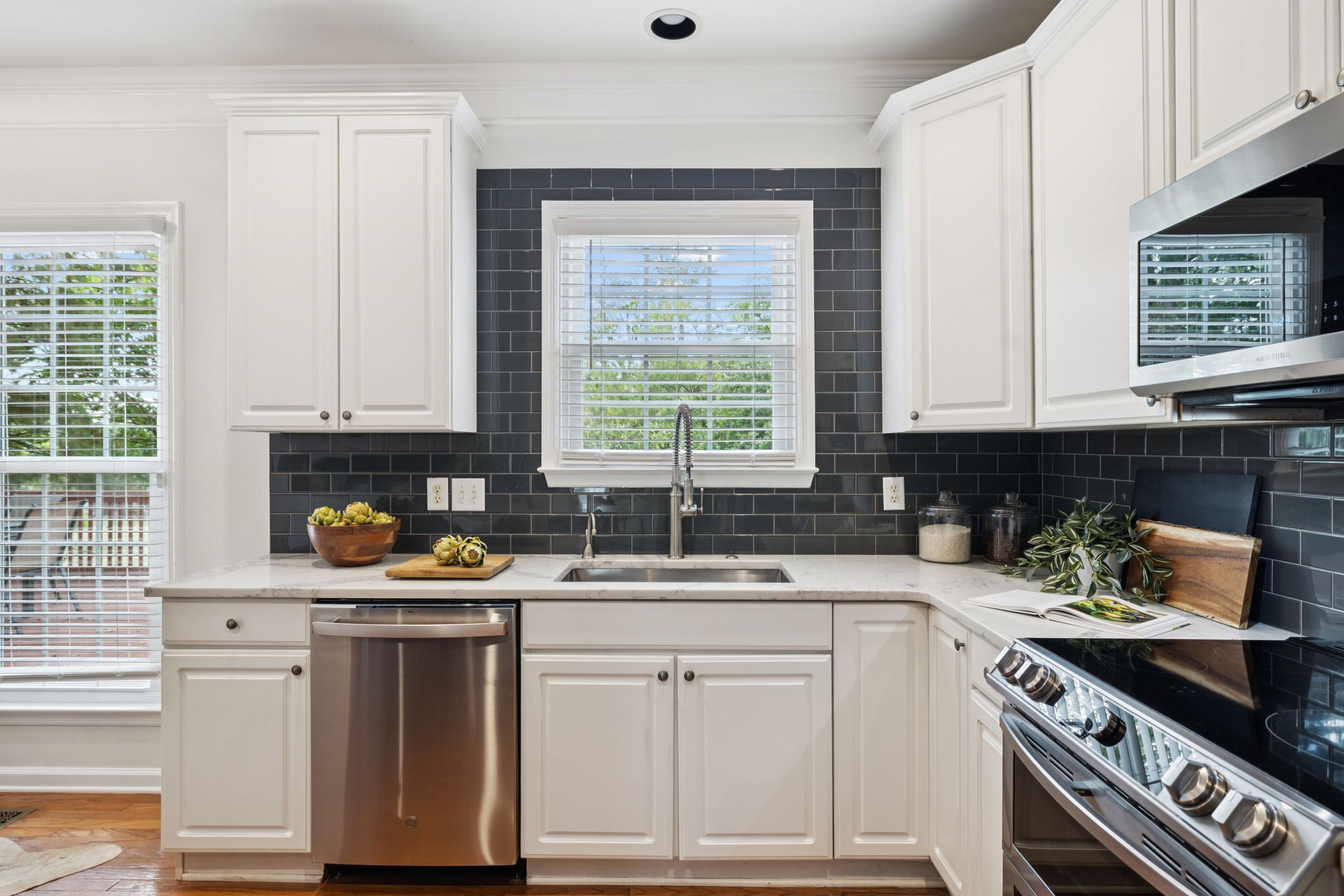 333 Springhouse Circle Franklin, TN 37067 - Photo 34 of 67 a kitchen with a sink stove and cabinets