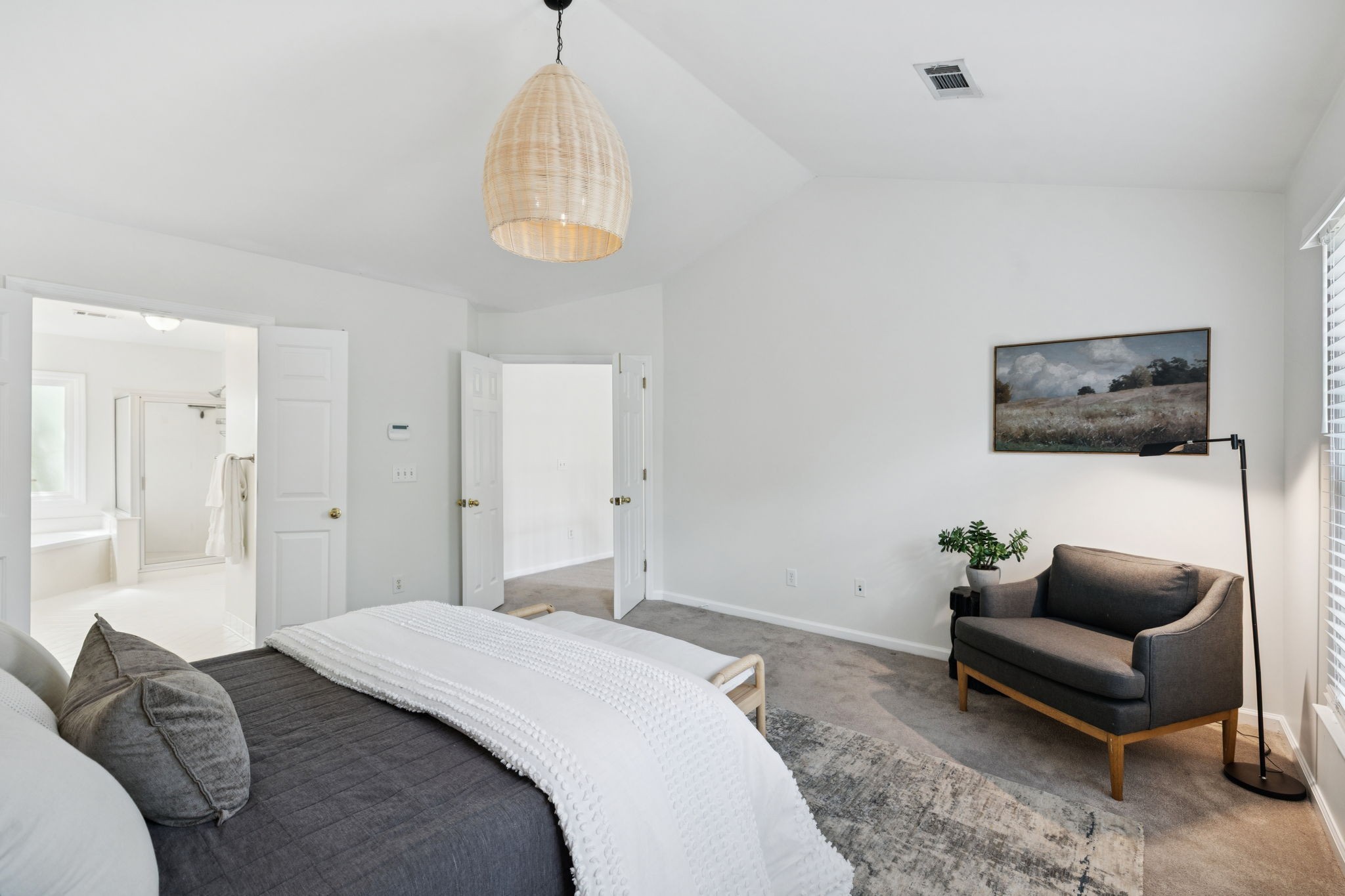 333 Springhouse Circle Franklin, TN 37067 - Photo 36 of 67 a spacious bedroom with a bed a couch and a flat screen tv