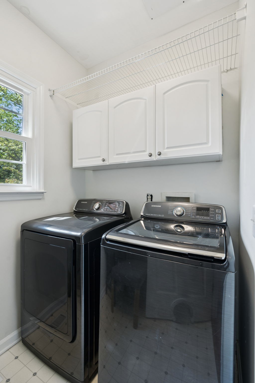 333 Springhouse Circle Franklin, TN 37067 - Photo 39 of 67 a utility room with stainless steel appliances a sink stove and cabinets
