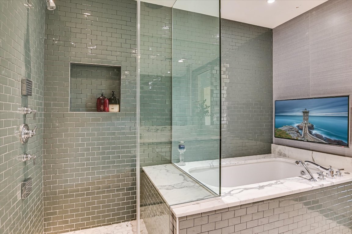 200 Congress Avenue, Unit 35AC Austin, TX 78701 - Photo 13 of 40 The primary bathroom has a separate walk-in shower.