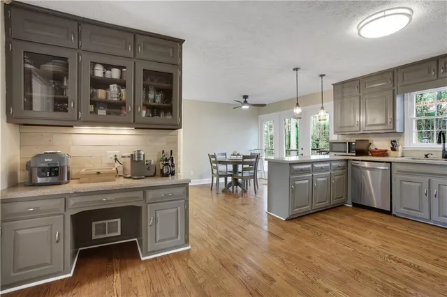 a bedroom with furniture and a flat screen tv
