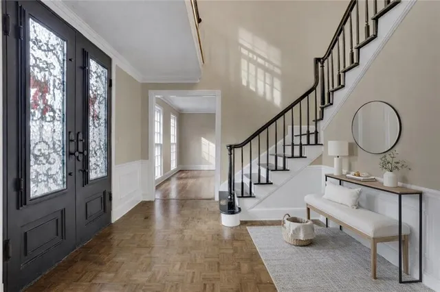 a view of a dining room with furniture and wooden floor
