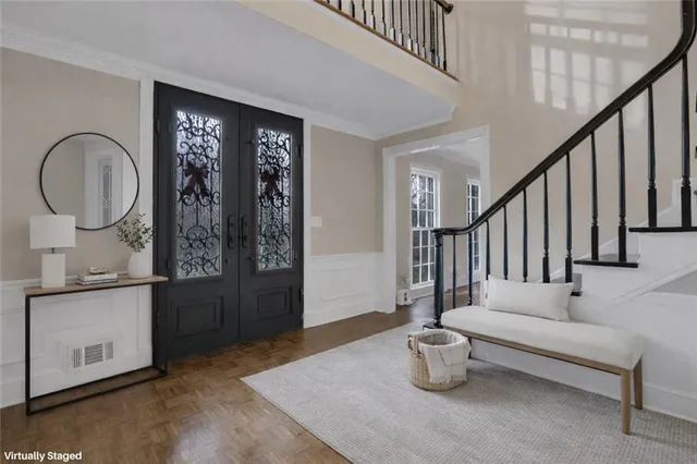 a view of an empty room with wooden floor