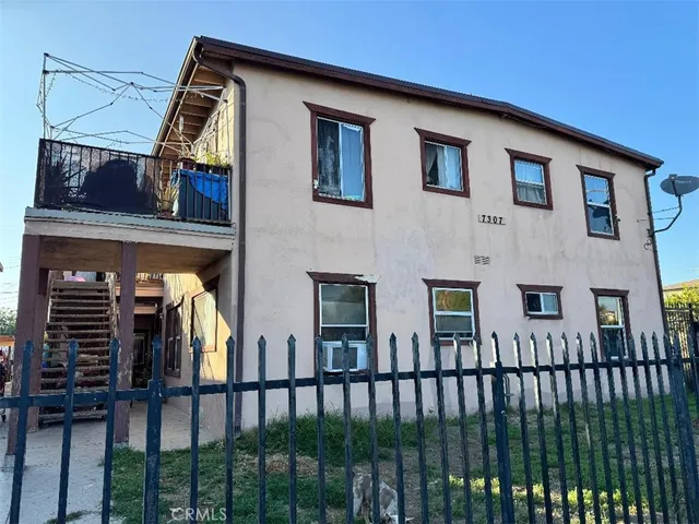 a view of a house with a small yard