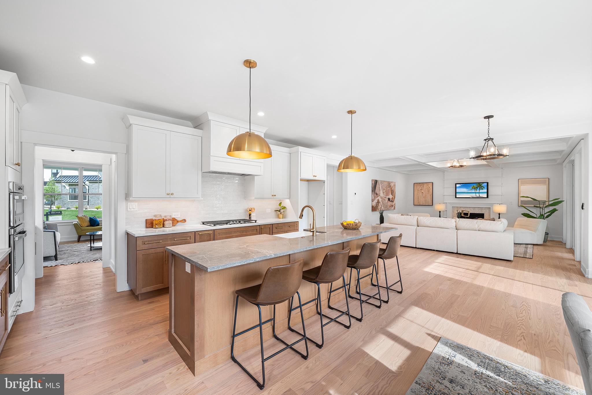 1815 Lot 1b Yost Road Blue Bell, PA 19422 - Photo 19 of 54 a kitchen with stainless steel appliances a stove a sink a oven a dining table and chairs with wooden floor