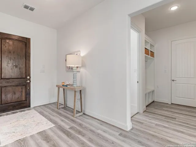 a living room with furniture potted plant and a window