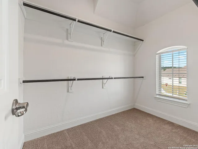 a view of an empty walk in closet