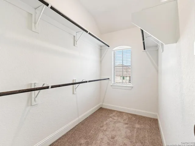 a view of a balcony with yard