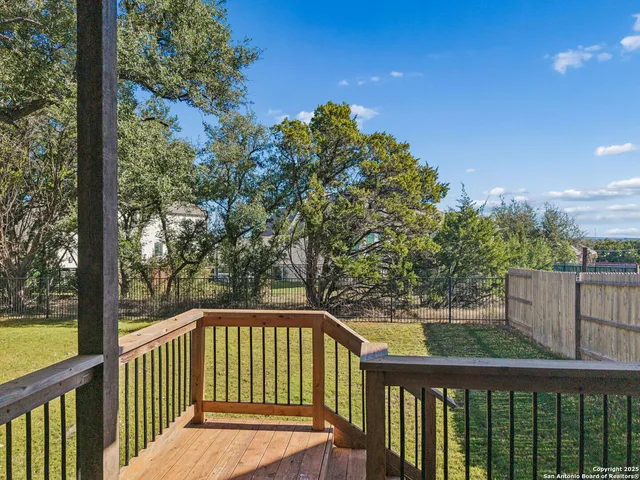a front view of house with a garden