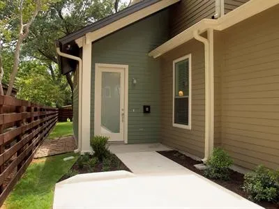 a view of house with backyard