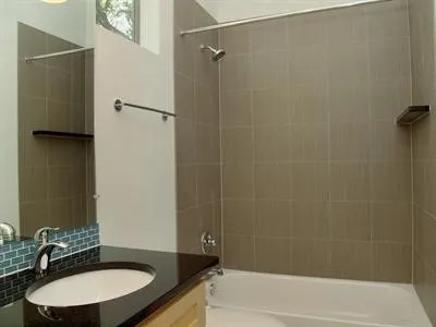 a bathroom with a sink and shower