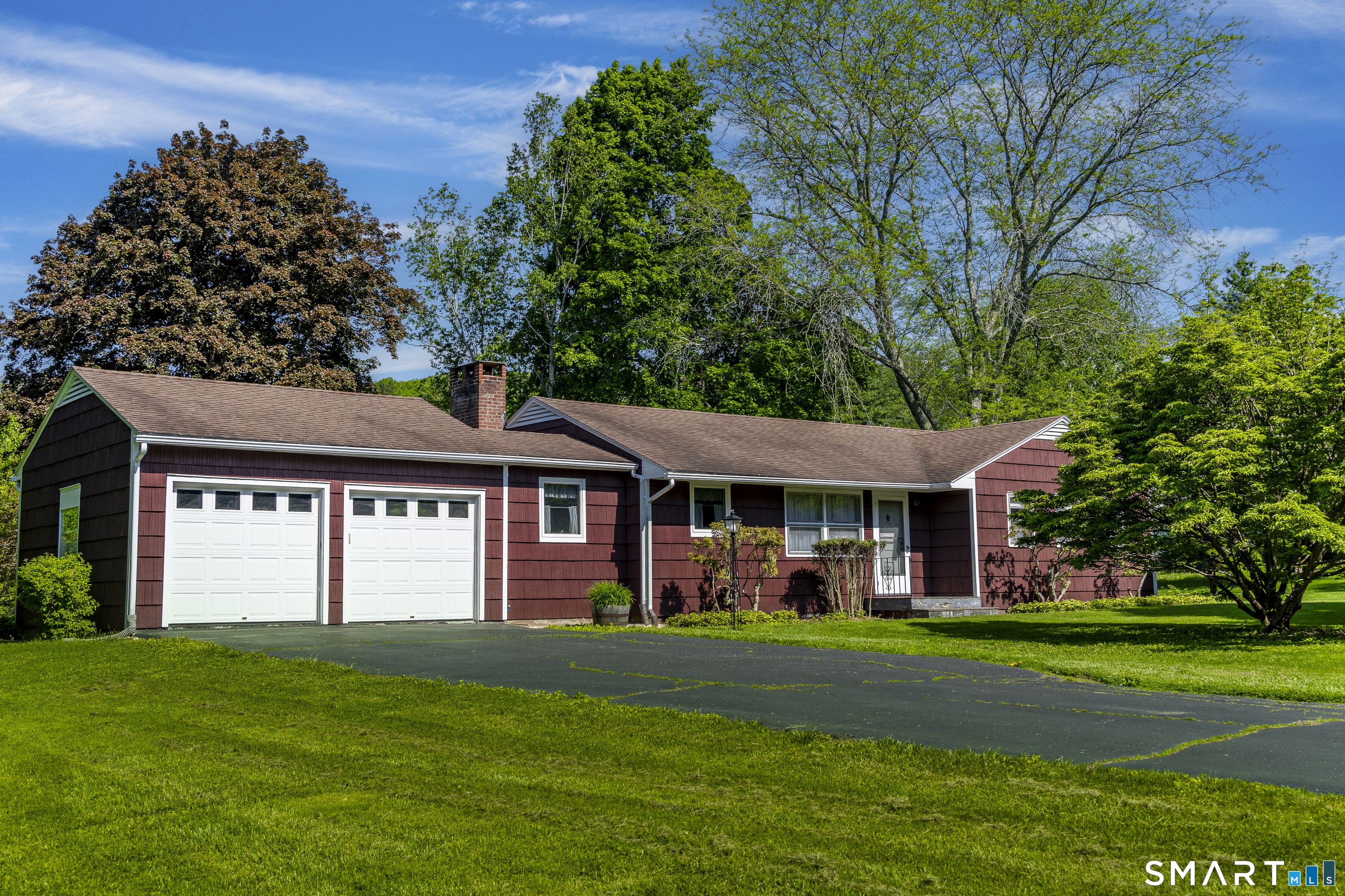 39 Indian Mountain Road Salisbury, CT 06039 - Photo 16 of 16 a front view of a house with a yard table and chairs