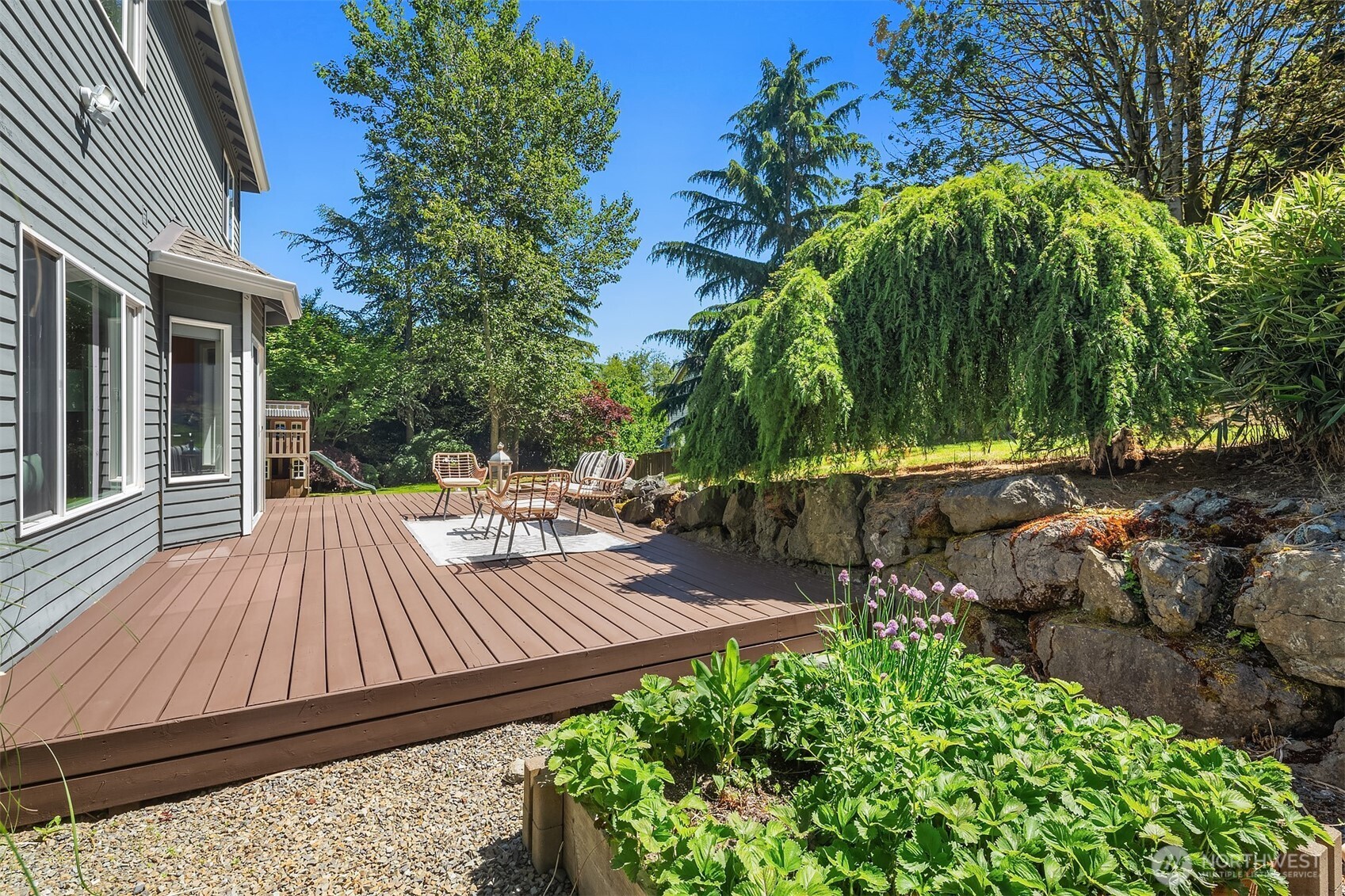 328 210 Street Southeast Bothell, WA 98021 - Photo 33 of 38 a view of backyard with sitting area