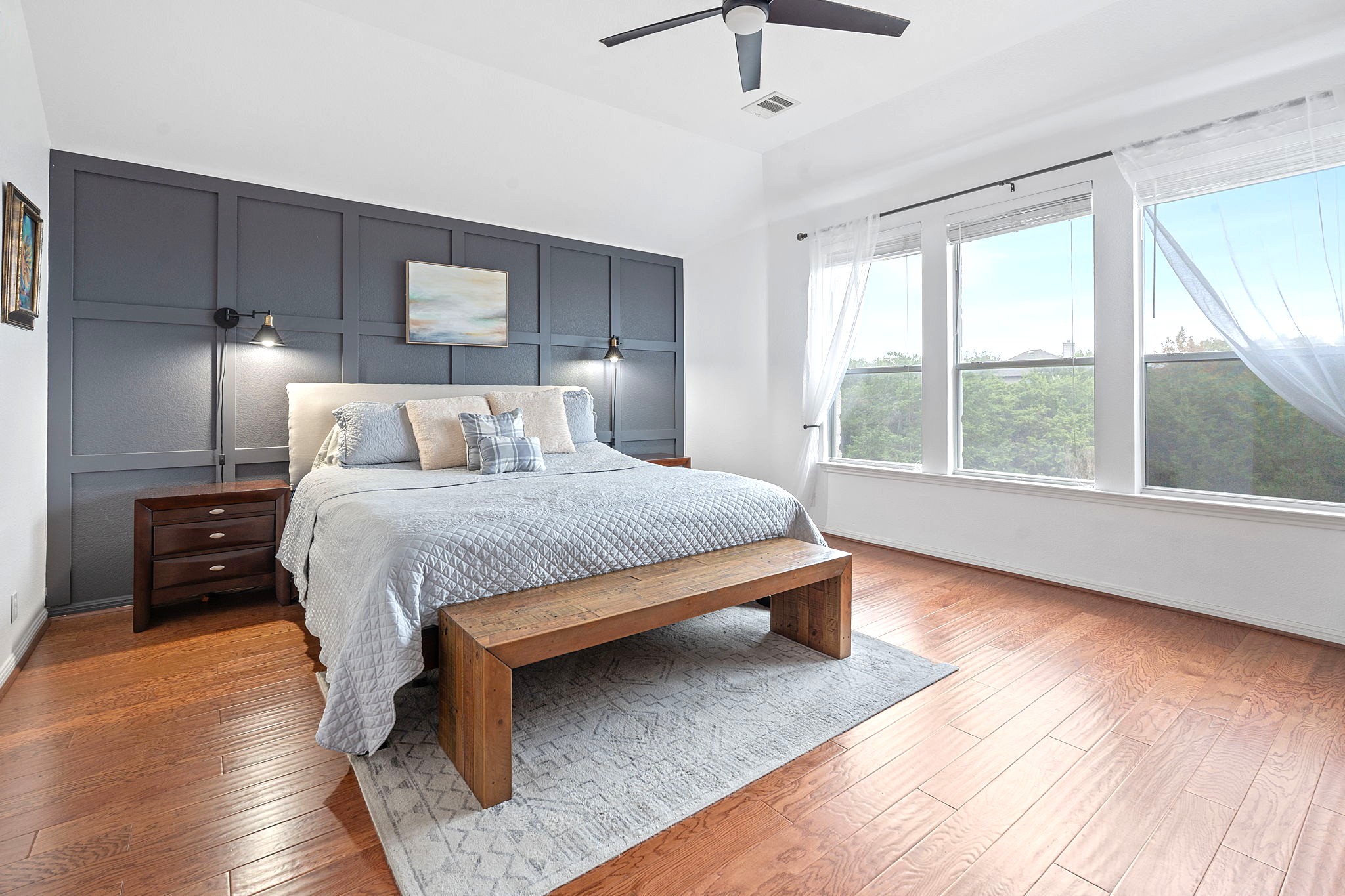 150 Manchester Lane Austin, TX 78737 - Photo 11 of 24 a bedroom with a large bed and a large window