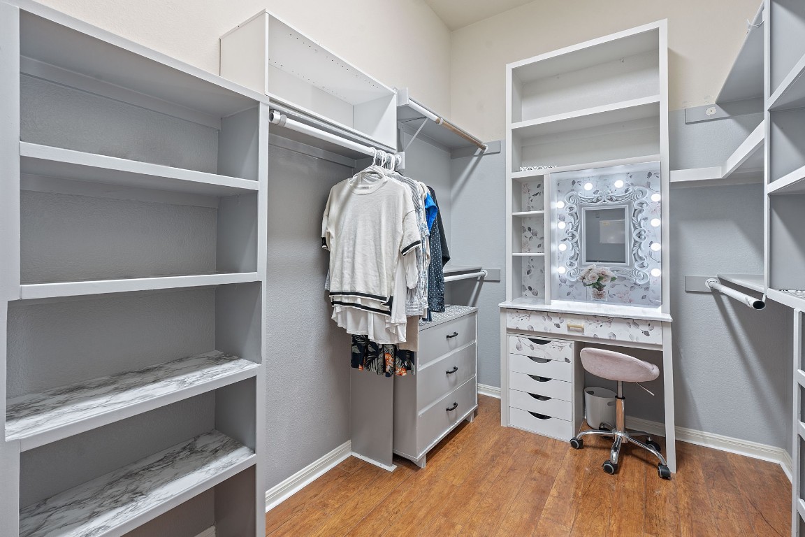 150 Manchester Lane Austin, TX 78737 - Photo 15 of 24 Walk in closet featuring light wood-type flooring
