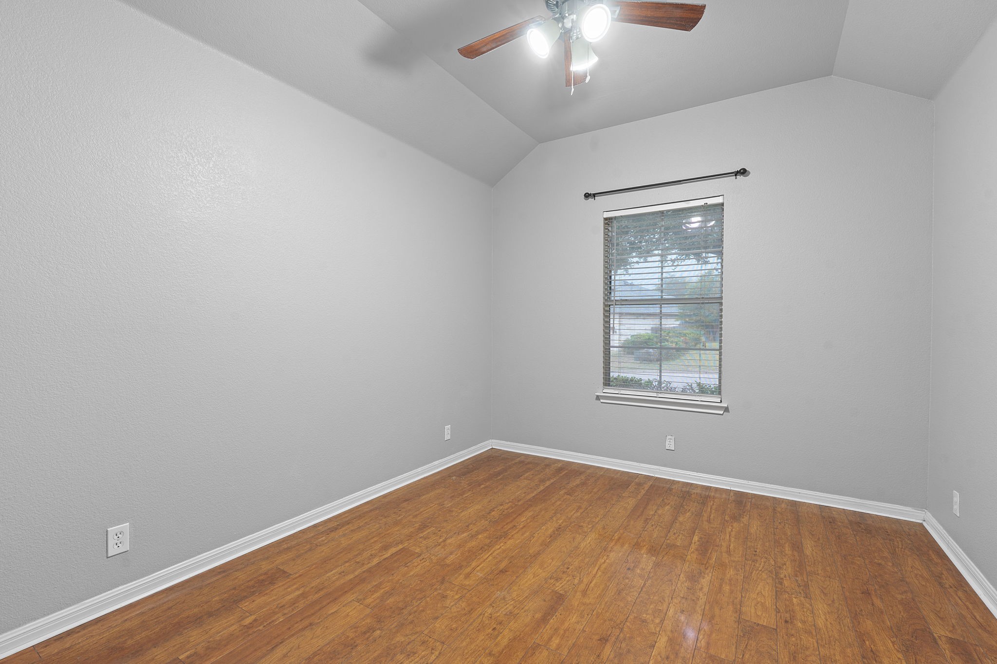 150 Manchester Lane Austin, TX 78737 - Photo 17 of 24 wooden floor in an empty room with a window