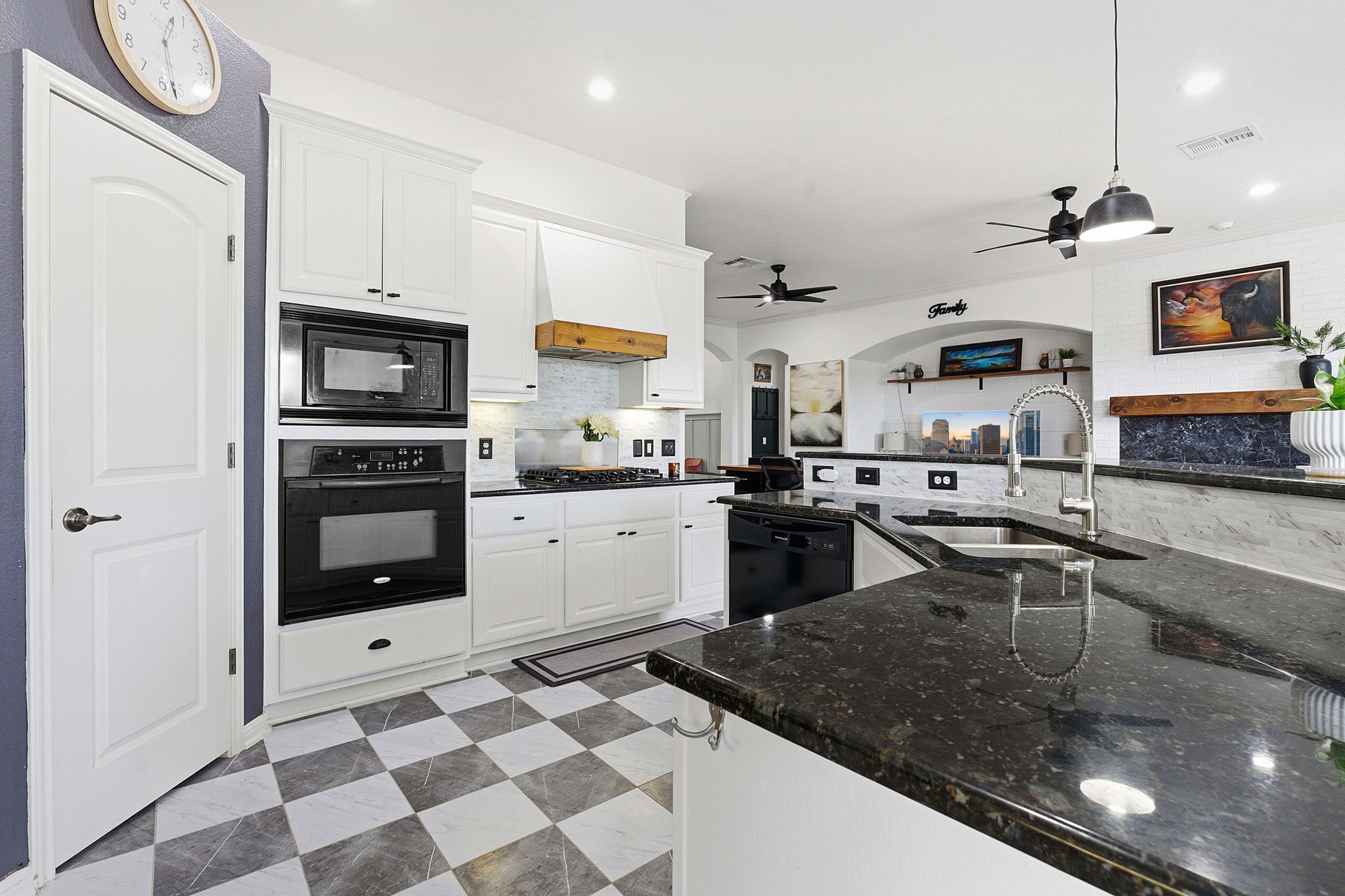 150 Manchester Lane Austin, TX 78737 - Photo 8 of 24 a kitchen with stainless steel appliances granite countertop a sink and a stove