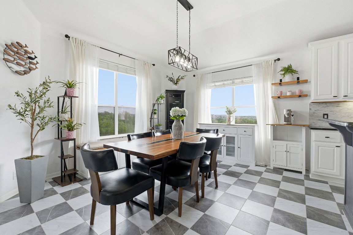 150 Manchester Lane Austin, TX 78737 - Photo 10 of 24 Dining room with healthy amount of natural light and light floors