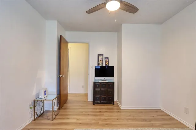 a view of a livingroom with a fireplace and chandelier