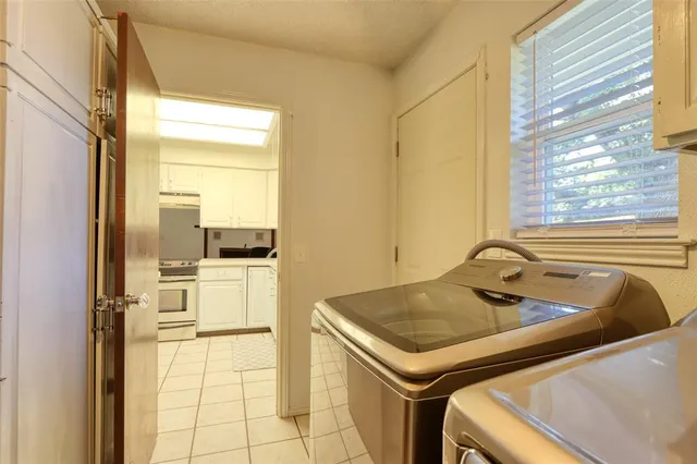 a kitchen with a sink and a stove top oven