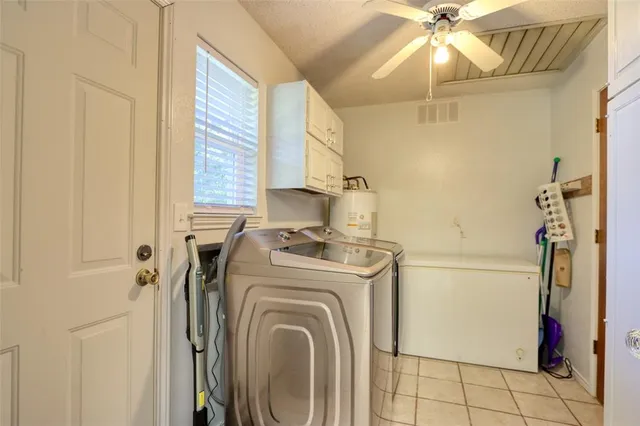 a view of a storage & utility room with a window