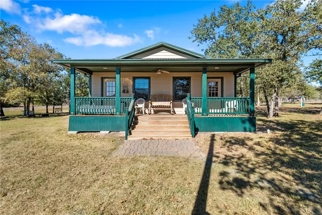 a view of a storage & utility room with closet wooden floor