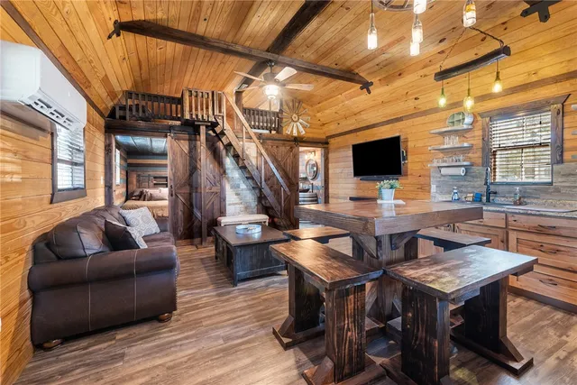 a bed sitting in a bedroom next to a large window