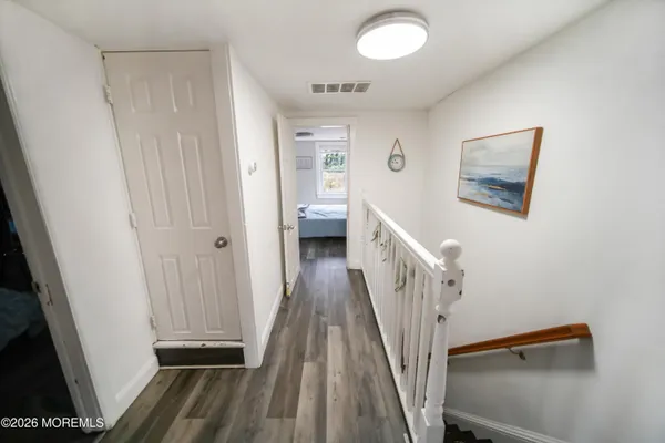 a bedroom with a bed couch and a window