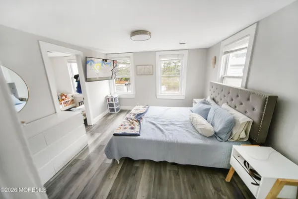 a utility room with furniture and a flat screen tv