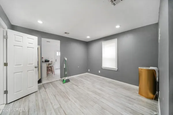 a kitchen with refrigerator and window