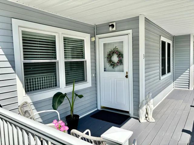 a backyard of a house with seating space