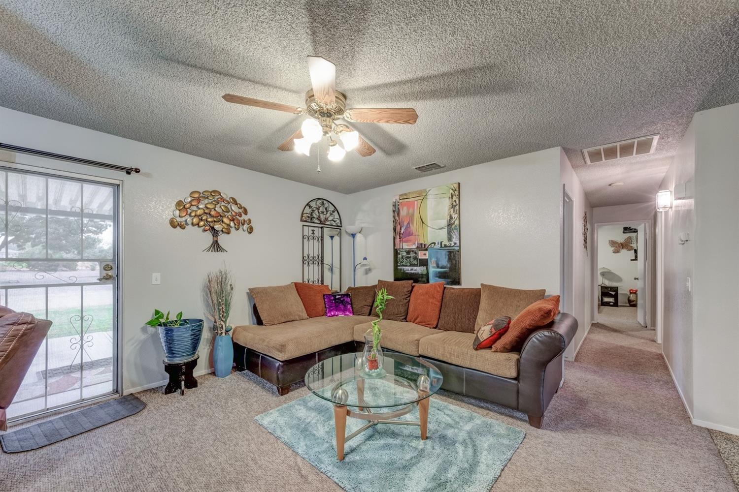 17609 Rodeo Drive Madera, CA 93638 - Photo 10 of 31 Living Room with sliding glass doors to your gorgeous patio, overseeing the .51 acres.