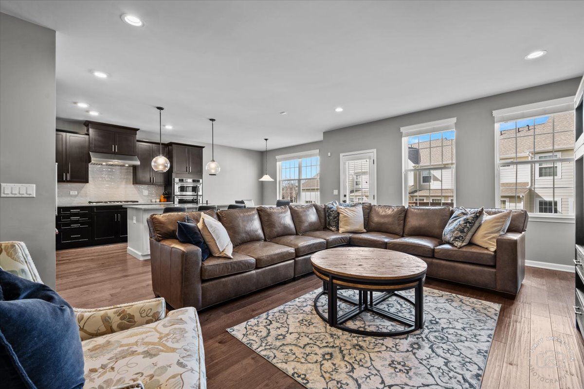 1261 Falcon Ridge Drive Elgin, IL 60124 - Photo 5 of 25 a living room with a couch and a view of kitchen
