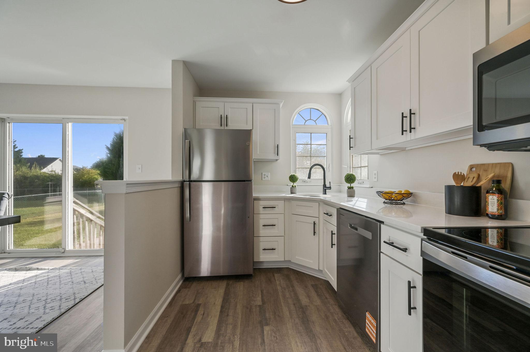63 Raphael Road Smyrna, DE 19977 - Photo 12 of 27 a kitchen with a refrigerator stove and sink