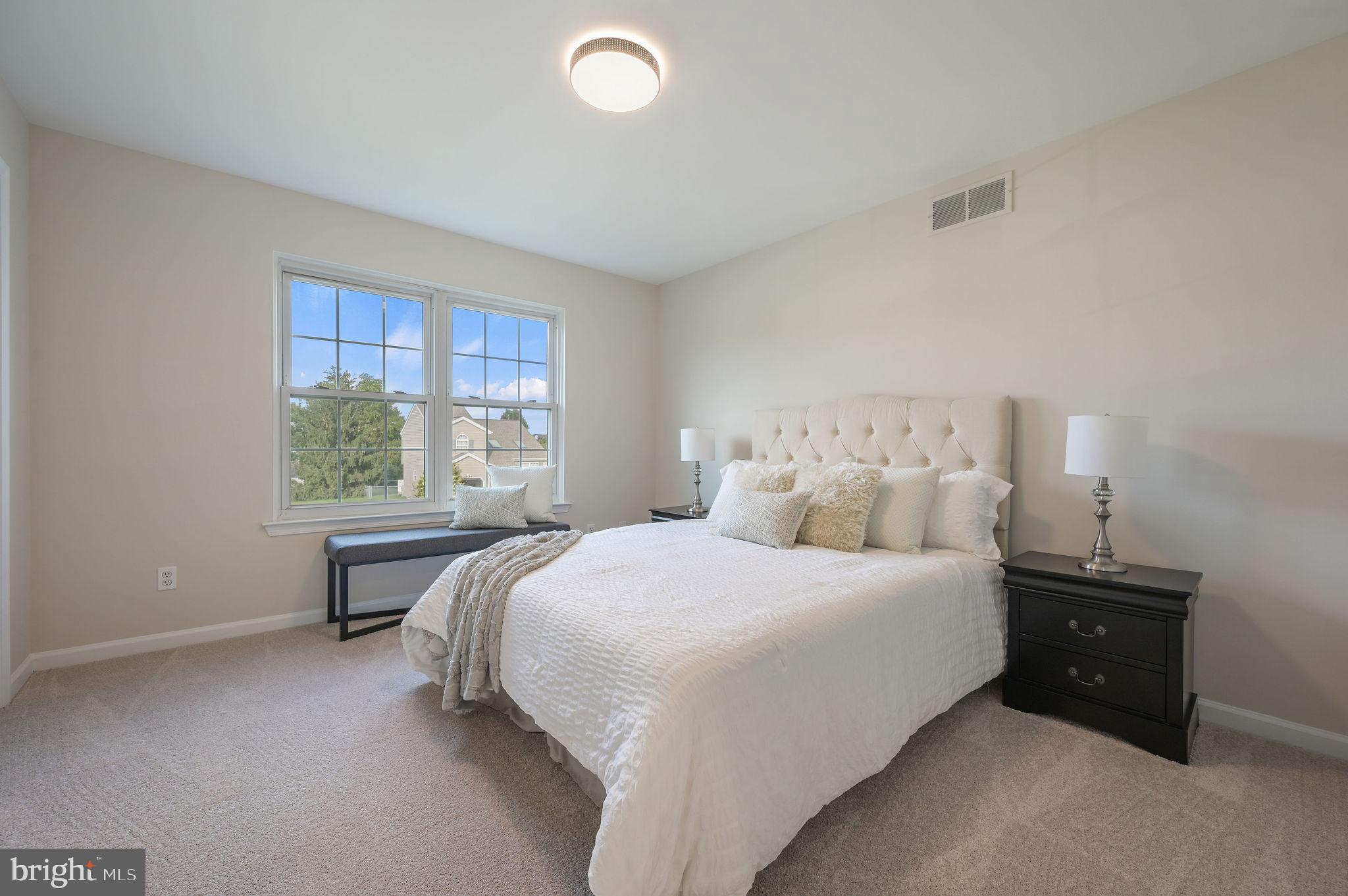 63 Raphael Road Smyrna, DE 19977 - Photo 14 of 27 a bedroom with a bed and window