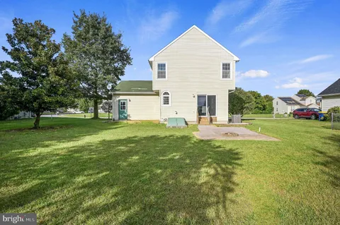 a view of house with yard