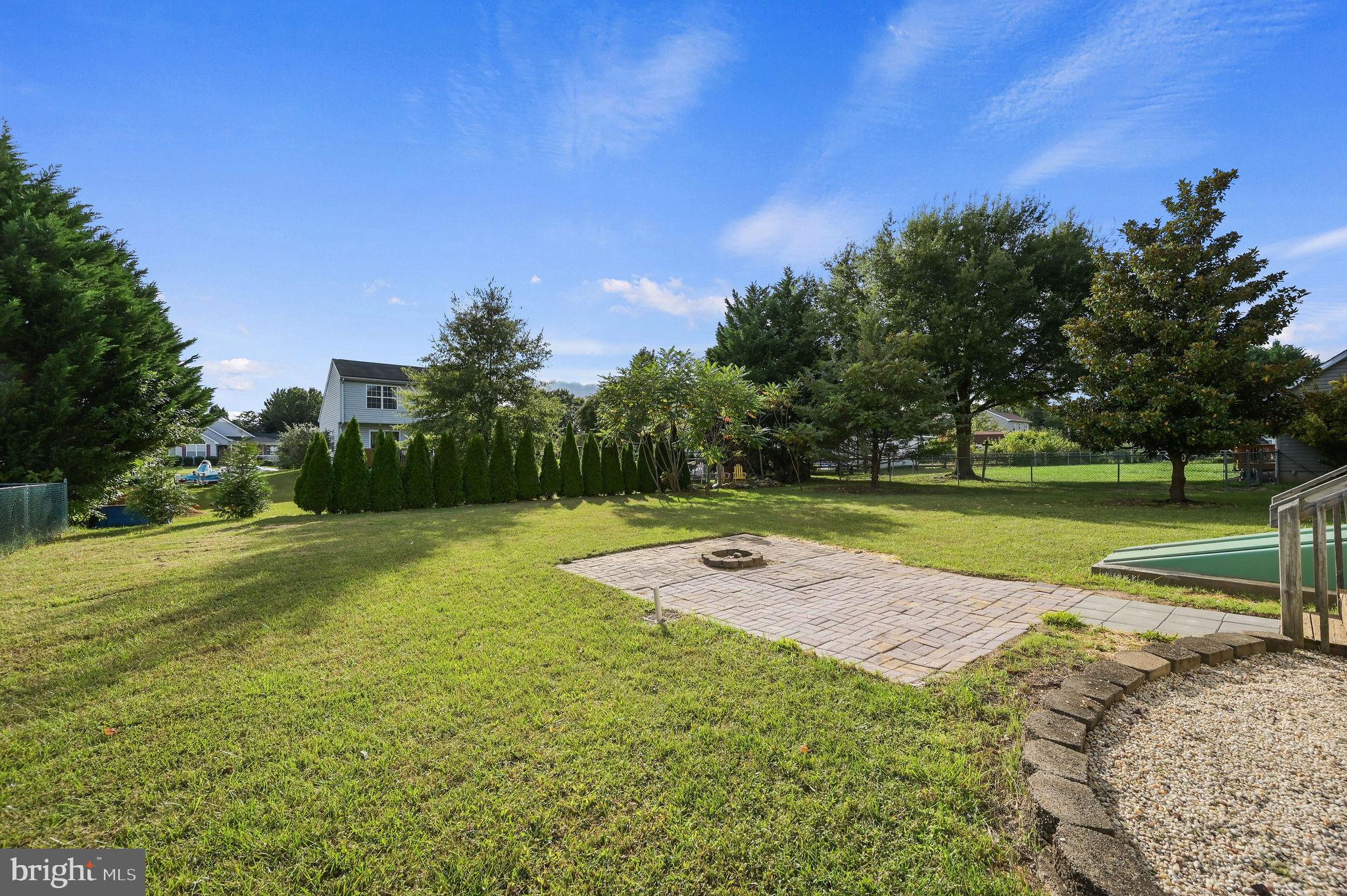 63 Raphael Road Smyrna, DE 19977 - Photo 27 of 27 a view of a tennis ground with large trees