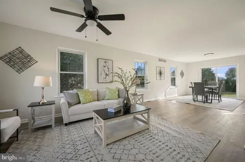 a living room with furniture and a table