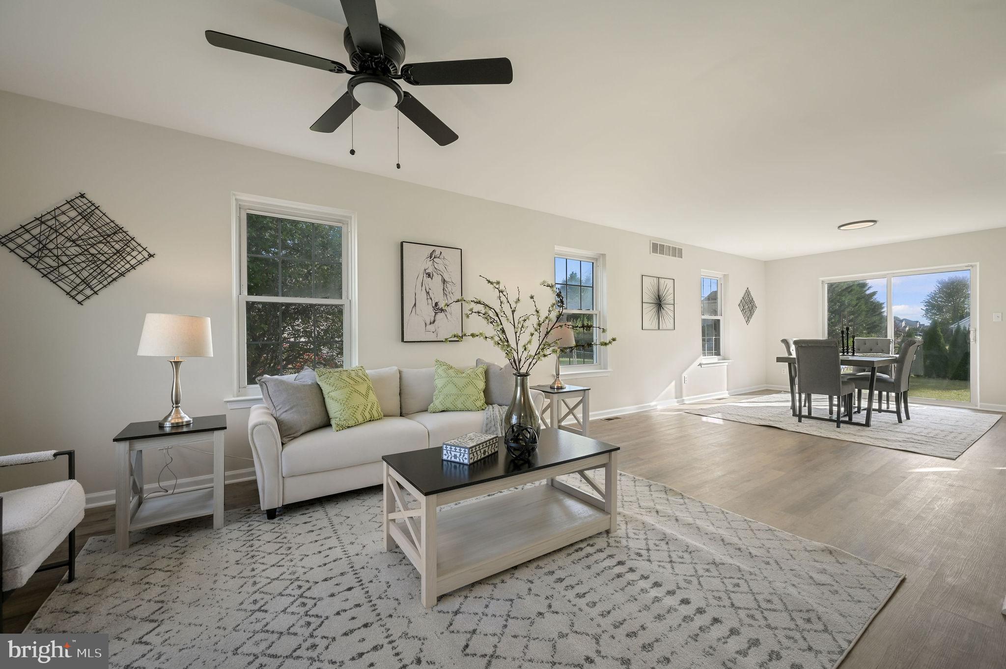 63 Raphael Road Smyrna, DE 19977 - Photo 3 of 27 a living room with furniture and a table