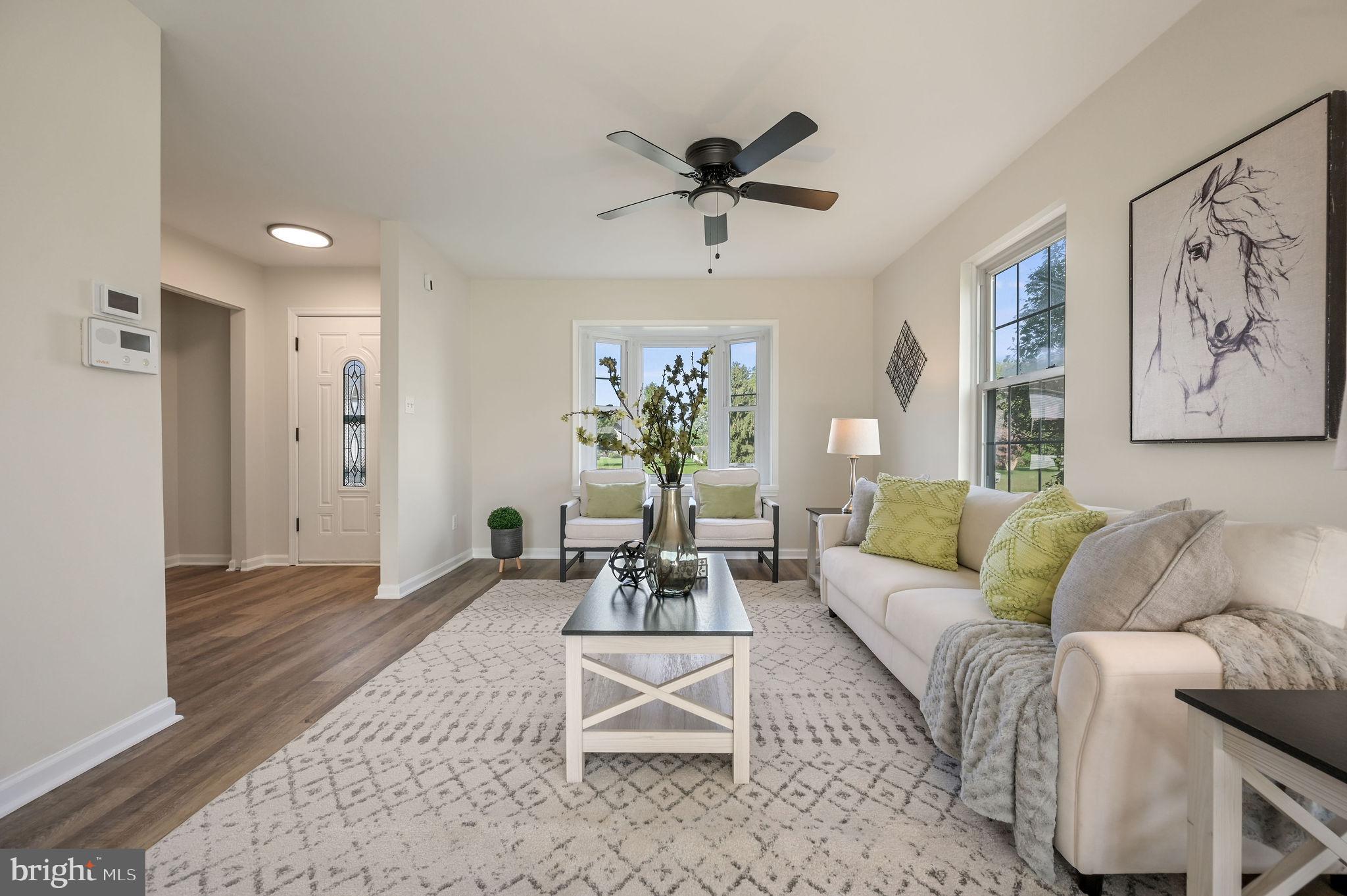63 Raphael Road Smyrna, DE 19977 - Photo 5 of 27 a living room with furniture and a large window